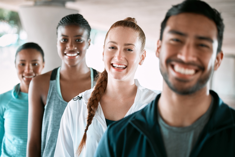 Cosmetic Dentistry for the Santa Cruz Community Active, fitness and portrait of group of people in city for workout, wellness gym and training class. Happy, sports and team of athletes with confidence for exercise with health together in town.