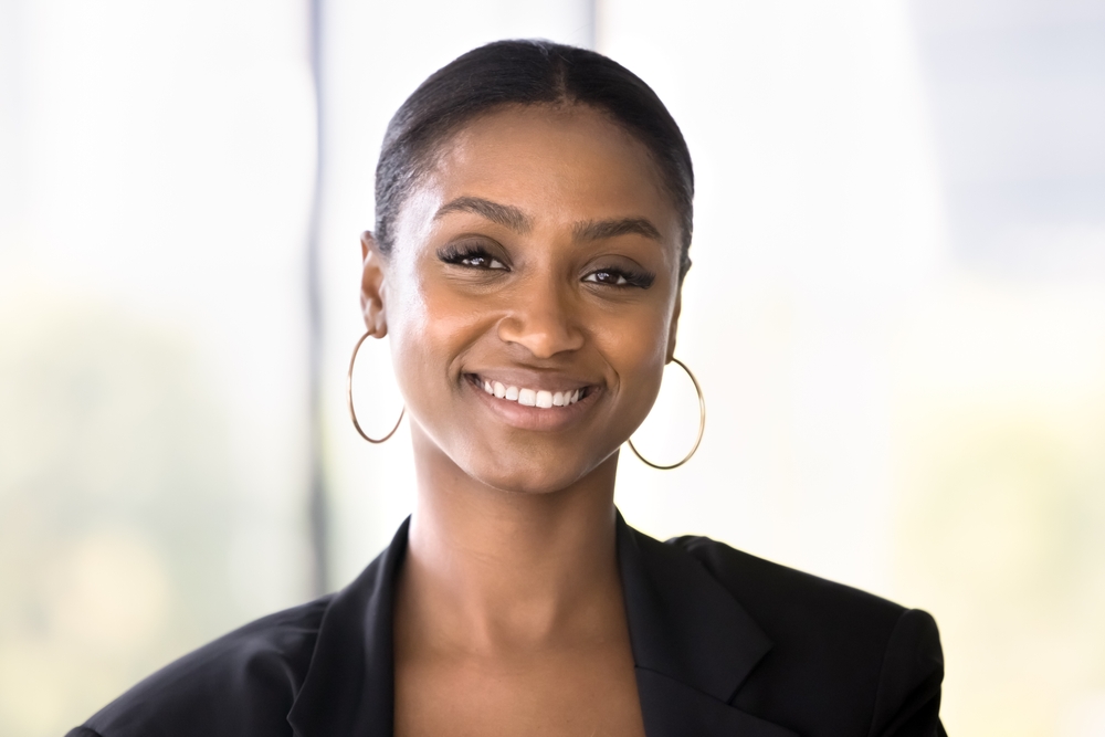 Confident Smiles from Dental Care in Scotts Valley Beauty and charisma. Head shot portrait attractive smiling young African American businesswoman professional specialist expert looking at camera feel confident successful motivated in career and life