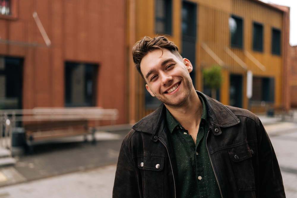 Natural-looking dental implant options in Scotts Valley, CA Smiling man outdoors representing natural-looking tooth replacement with dental implants in Scotts Valley, CA