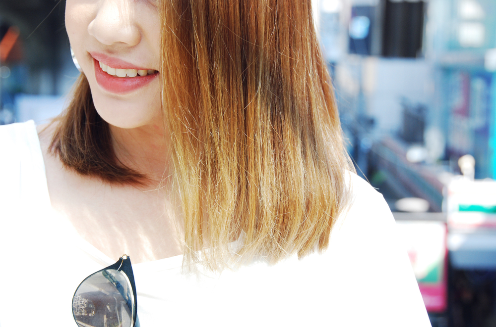 Close-up beautiful Asia women face smile portrait and traveling in city.